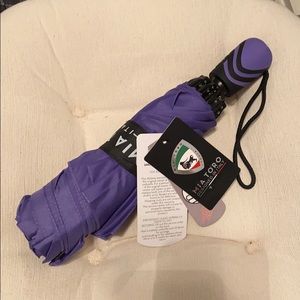 Mia Toro automatic open/close purple umbrella.